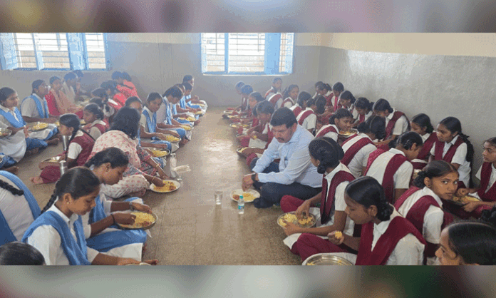 Additional Collector B Venkateswarlu inspects facilities and food quality at the Government Girls Residential School in Sofinagar.