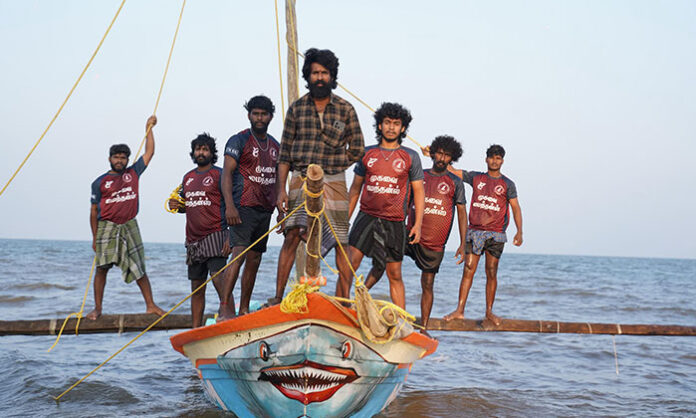 Soori and Suhas featured in Mandaadi release date poster set against a coastal backdrop ahead of the worldwide release