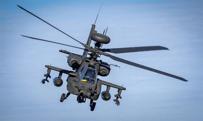 US military Apache helicopter involved in a crash near the Strait of Hormuz while both crew members escaped safely.
