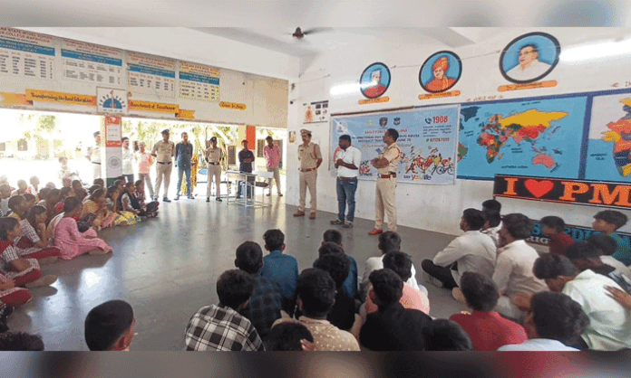 CI Dudi Raju addresses students during a drug awareness program, urging them to stay away from narcotics and focus on education.