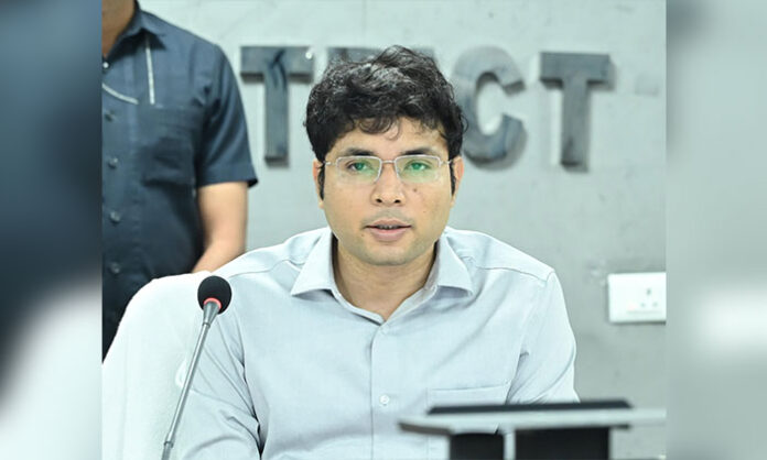District Collector Bhavesh Mishra reviewing education department initiatives to prevent student dropouts in government schools.