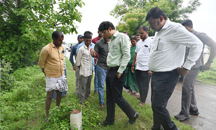 District Collector Bhavesh Mishra interacting with villagers during an inspection of drinking water facilities in Ambugam village.