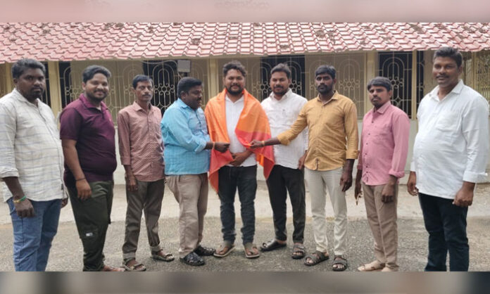 Newly elected Congress SC Cell Mandal President Chityala Sagar being felicitated at the R&B Guest House in Venkatapuram in the presence of Congress leaders and MRPS representatives.