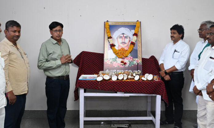 Officials pay floral tributes during the Doddi Komaraiah Death Anniversary observed at the Collectorate conference hall.