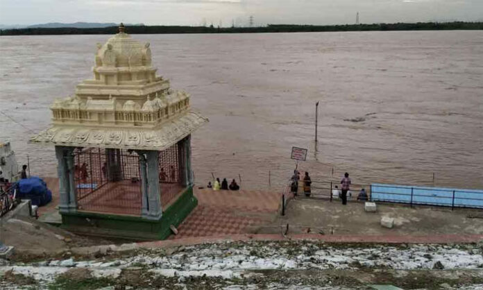 The Godavari River in spate at Bhadrachalam as floodwaters push the water level to 44 feet, prompting the first danger warning.