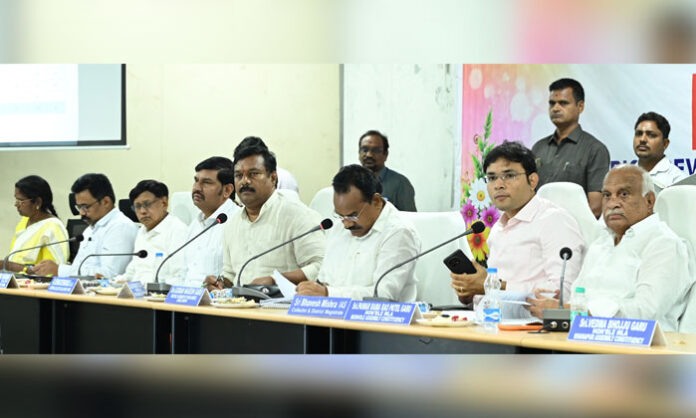 MP Godam Nagesh and District Collector Bhavesh Mishra chairing the DISHA meeting to review government welfare schemes and development projects in Adilabad district.
