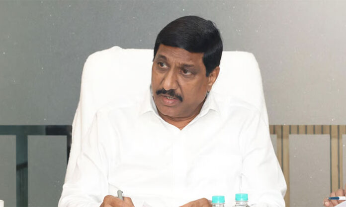 Andhra Pradesh Minister Janardhan Reddy addresses a Gram Sabha in Banaganapalle while criticizing the previous YCP government's development record.