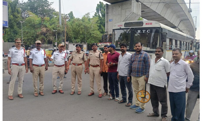 Traffic police and civic officials conduct a joint road pothole inspection at Musheerabad Junction to improve traffic flow and begin CC road construction.