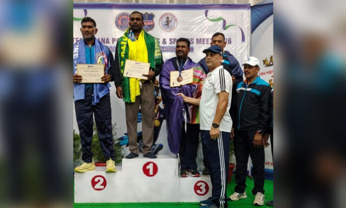 Raja Goud receives a bronze medal after securing third place in the freestyle wrestling event at the Telangana Police Games and Sports Meet.