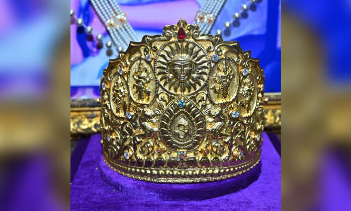 A devotee from Eluru presents a Rs 1.03 crore gold crown to Shirdi Sai Baba during Guru Purnima celebrations.