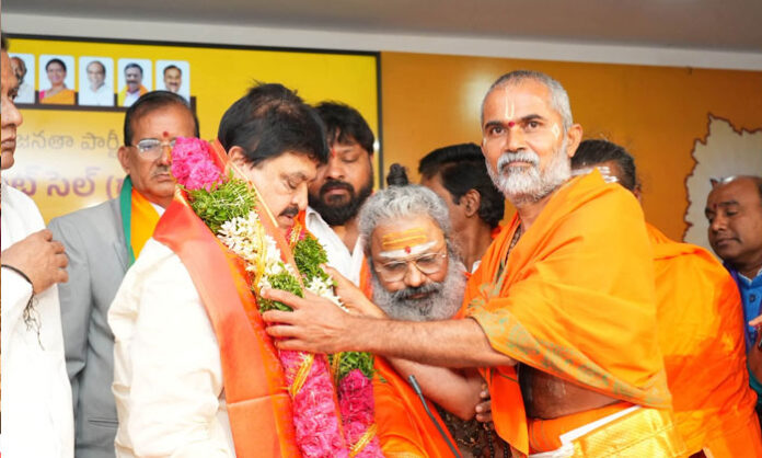 BJP leaders distribute appointment letters to members of the newly formed Telangana BJP Endowments Cell state and district committees in Hyderabad.