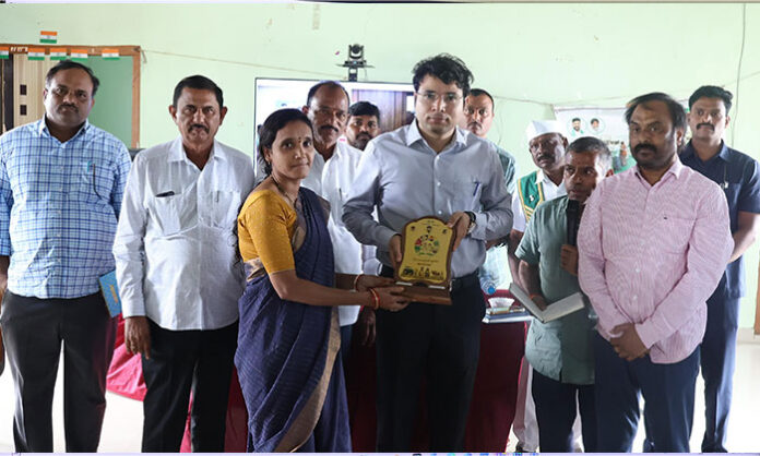Agriculture Minister Tummala Nageswara Rao addresses farmers during the 100th episode of the Rythu Nestham program in Hyderabad.