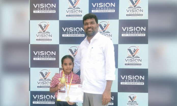 Vision High School student R. Chaithra Reddy receives a gold medal at the state-level SIP Abacus competition held in Hyderabad.