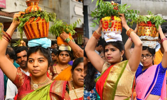 Devotees carrying Bonam offerings during the Bonalu Festival, celebrating Telangana's rich culture and traditions.
