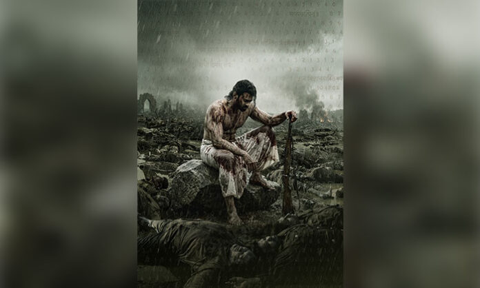 Prabhas appears in a rugged, battle-worn avatar in the release date poster of the pan-India film Fauzi.