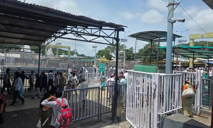 Thousands of devotees wait in long queues for Srivari Darshan at Tirumala as the Vaikuntham Queue Complex remains completely full.