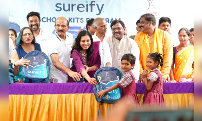 Minister Dr. G. Vivek Venkatswamy distributes free school bags to students at Chegunta Government High School and promises efforts to establish a Government Degree College.