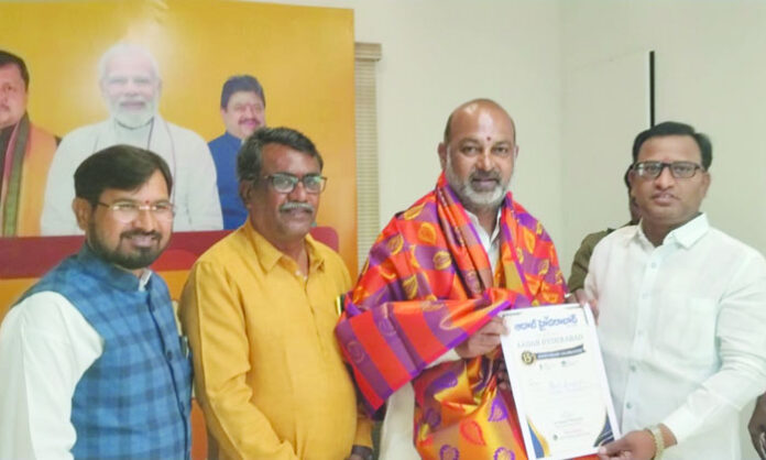 Aadab CMD Satyam Veeramalla presents 15th anniversary invitations to key BJP leaders in Telangana