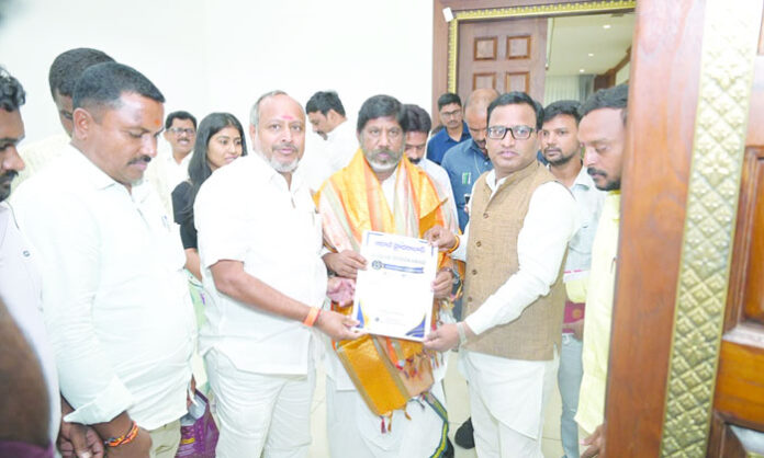 Aadab Hyderabad CMD Satyam Veeramalla presents 15th anniversary invitation to Deputy CM Bhatti Vikramarka
