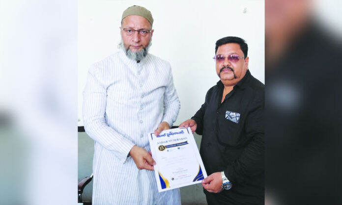 Aadab Hyderabad representative Mohammed Siraj Ahmed presents 15th anniversary invitations to prominent personalities