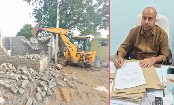 Revenue officials demolish illegal constructions in Jawahar Nagar GHMC limits under the supervision of Kapra Tahsildar Matin.