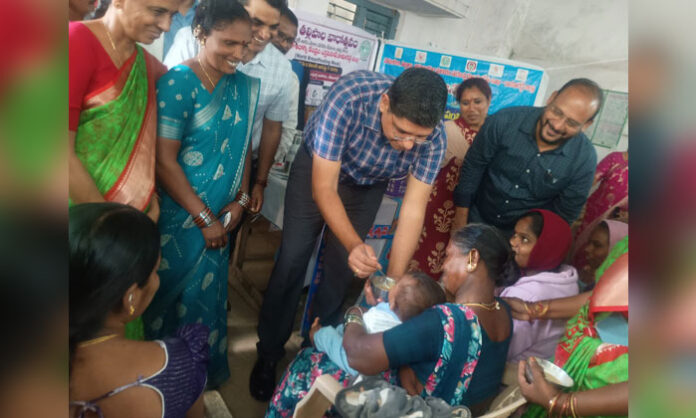 Kamareddy District Collector Ashish Sangwan participates in Breastfeeding Week celebrations and performs the Annaprasana ceremony at Errapahad PHC.