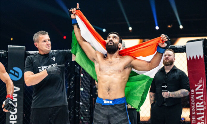 Indian MMA fighter Owais Yaqoob celebrates his victory over Bulgaria's Delyan Georgiev at the BRAVE CF 107 event.