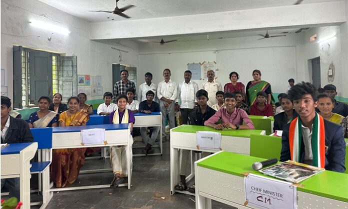 Students participate in a mock assembly program at Rayanigudem Zilla Parishad High School