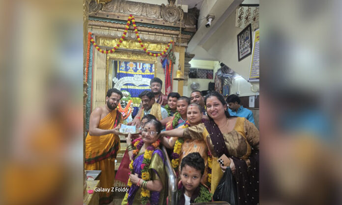 Muriki Chandramouli and his family donate Rs. 2.5 lakh to the Yogananda Lakshmi Narasimha Swamy Temple in Koti.