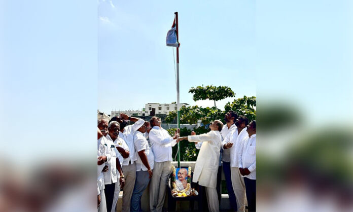 Chinta Prabhakar hoists the national flag during National Integration Day celebrations in Sangareddy