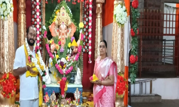 Sri Ausali Veeranna and Vijayalakshmi securing the Mahaganapathi Laddu for Rs. 36,00,001 at Panchavati Kshetram