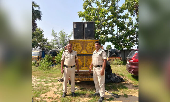 Police seize a high-decibel DJ system following an alleged violation of sound restrictions during the Ganesh Nimajjanam procession in Pedaveedu village.