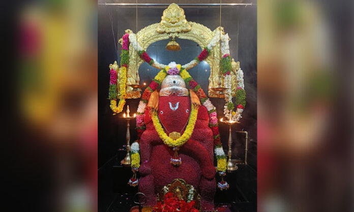 Lord Siddhi Ganapathi appears in a crimson Raktha Varna attire on the seventh day at Sri Ganesh Gadda in Rudraram
