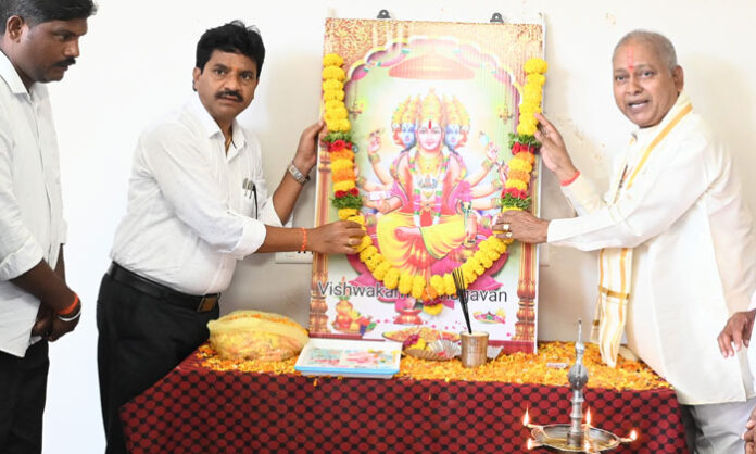 Vishwakarma Jayanti celebrations held at the Collectorate with officials offering floral tributes