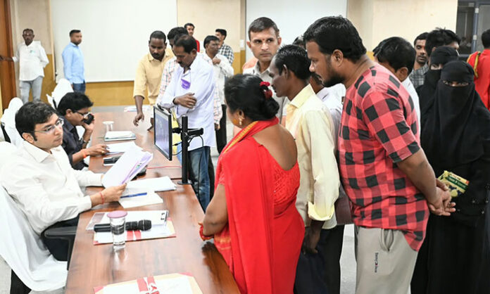 District Collector Bhavesh Mishra receives public complaints during the Prajavani program at the Collectorate.