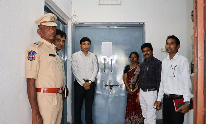 Collector Bhavesh Mishra inspects security arrangements at the EVM warehouse near the Nirmal Collectorate.