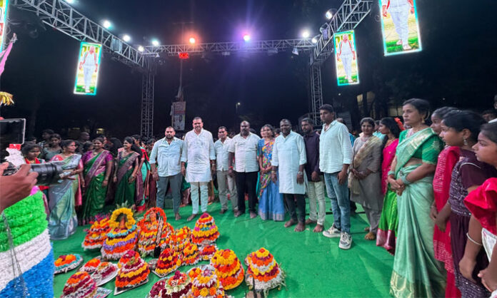 Women and young girls participate in Bathukamma festival celebrations organized by the RR Foundation in Medchal.