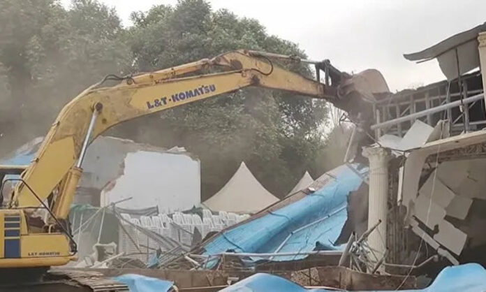 Secunderabad Cantonment Board officials demolish the controversial KJR Garden function hall following court orders.