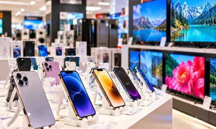 Smartphones displayed in a retail store as mobile phone prices drop amid weak festive season sales and rising unsold stocks.