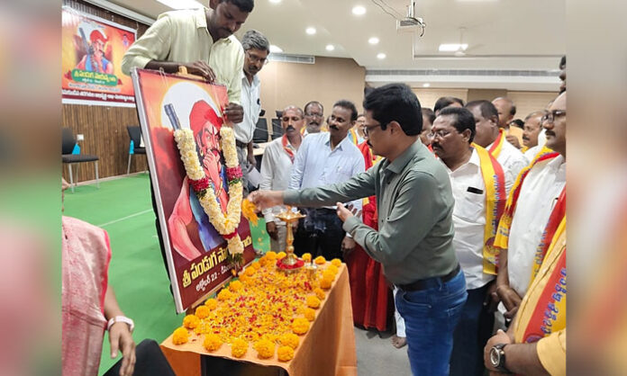 Officials pay floral tributes to Panduga Sayanna Mudiraj during his birth anniversary celebrations at the Mancherial district offices complex.