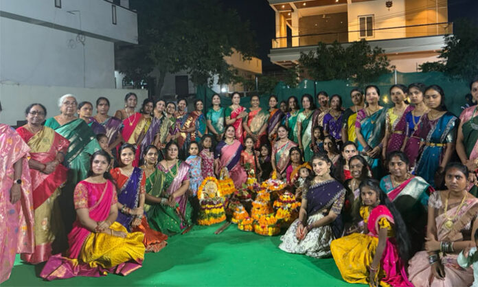 Women celebrate Saddula Bathukamma with traditional songs and floral arrangements in Kaveri Nagar, Nirmal.