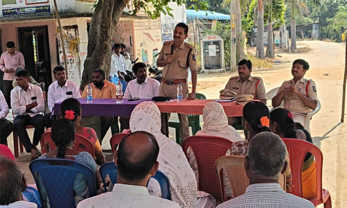 Yellareddy DSP Srinivas Rao addresses villagers in Santhayipet on cybercrime, narcotics, child labour and child marriage awareness.