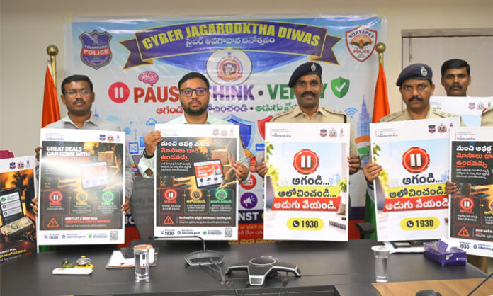 Collector Tejas Nandlal Pawar and SP K Narasimha unveil cyber awareness poster